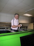 SX12322 Simon standing in hole in roof of campervan.jpg